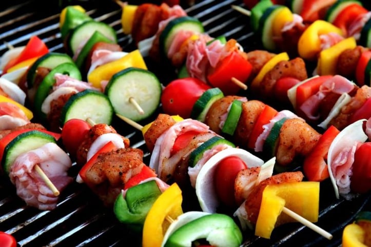 Chicken and vegetable skewers on grill