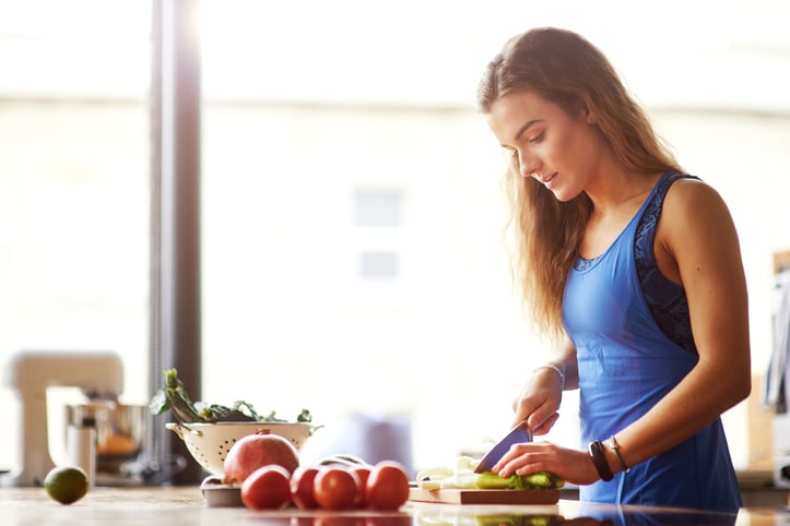 Personal Trainer Cutting Fruits and Vegetables 