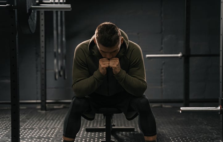 A man stressed at a gym