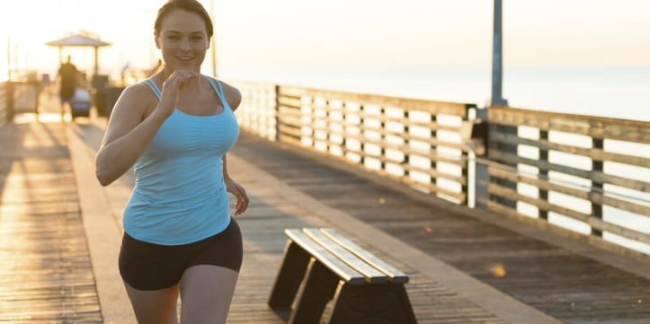 female running on board walk