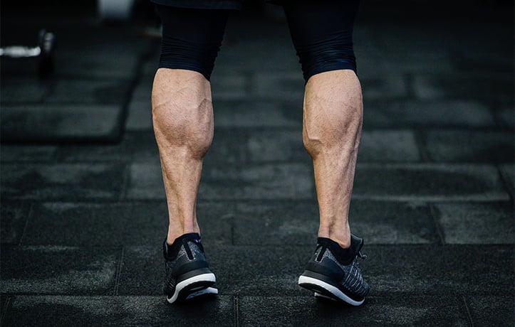 a man doing calf workout on stairs
