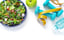 A table with salad, weights and fruits