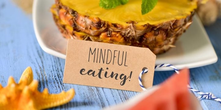 Pineapple with "Mindful eating" tag in front of it