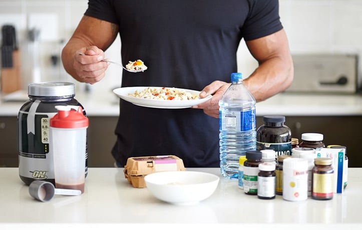 man boosting testosterone with foods and supplements