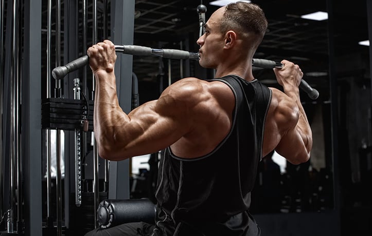 a bodybuilder doing lat pulldowns