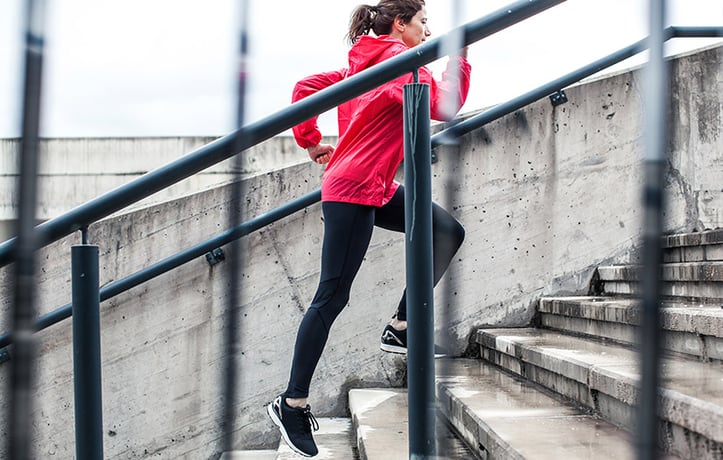 woman running up stairs