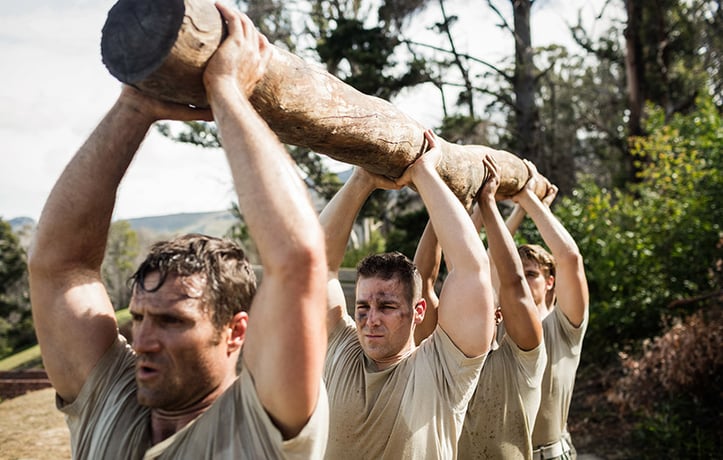 marines doing a log carry exercise