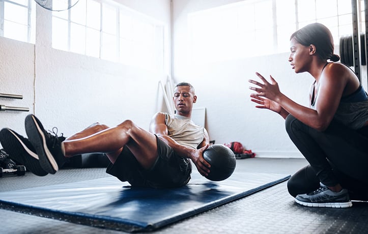 a trainer utilizing muscle memory with an exercise