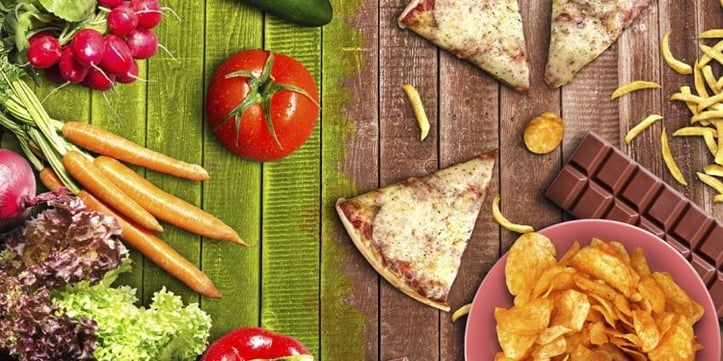 Table with pizza and vegetables 