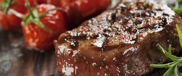 Grilled steak with roasted tomatos