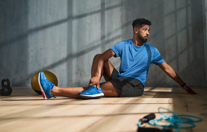 a man stretching on the floor