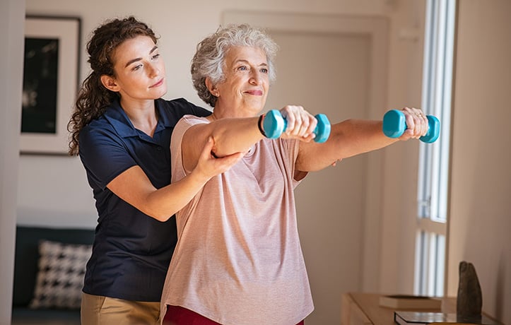 a senior fitness trainer training a client